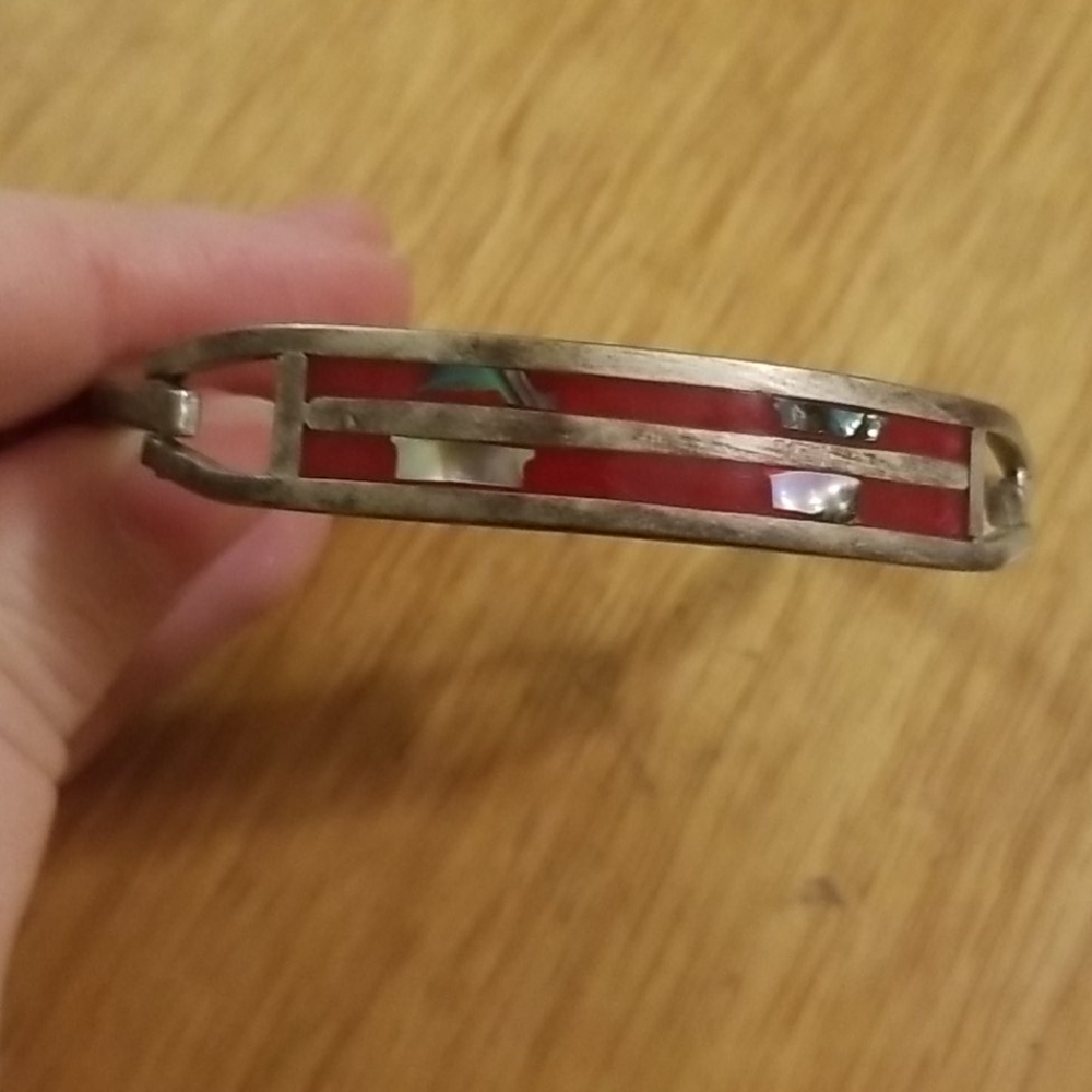 Handmade bracelet with red silver and green detail
